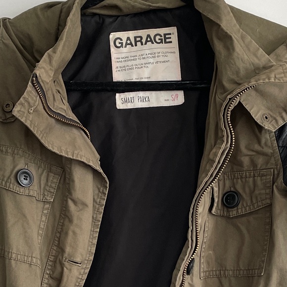 Garage army green parka jacket w/ black leather sleeves. Gently worn. Size Small - Picture 2 of 2
